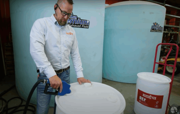 ToughAg rep filling barrel with Diesel Exhaust Fluid DEF